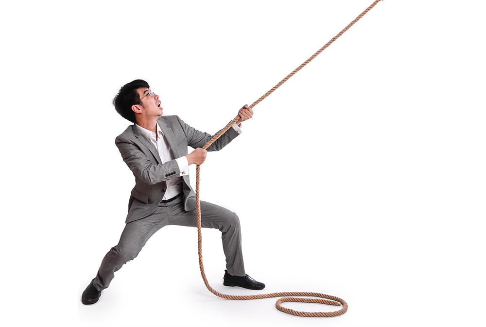 a man pulls a rope