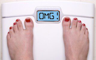 Digital Bathroom Scale Displaying OMG Message